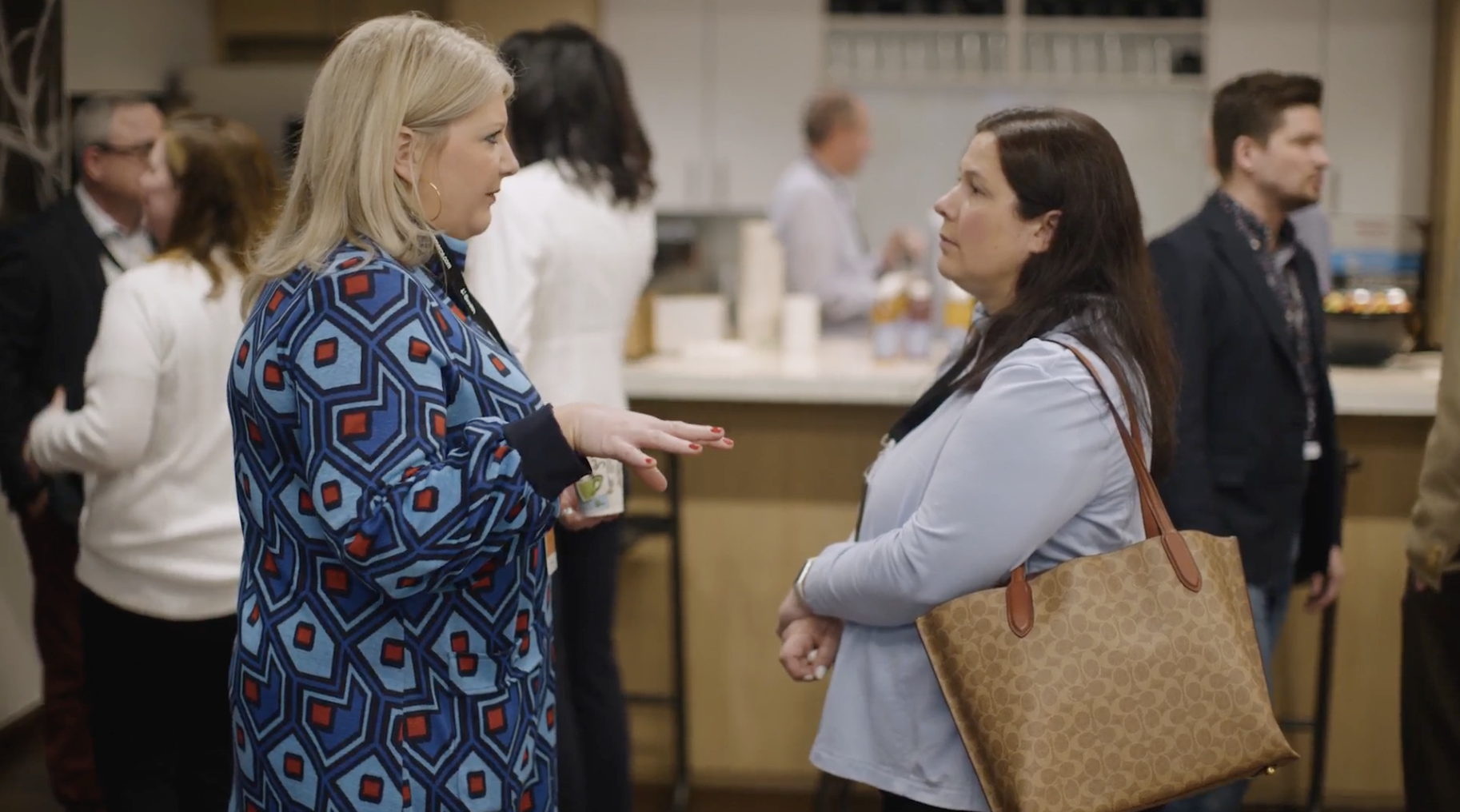 Image of two client standing and talking to each other