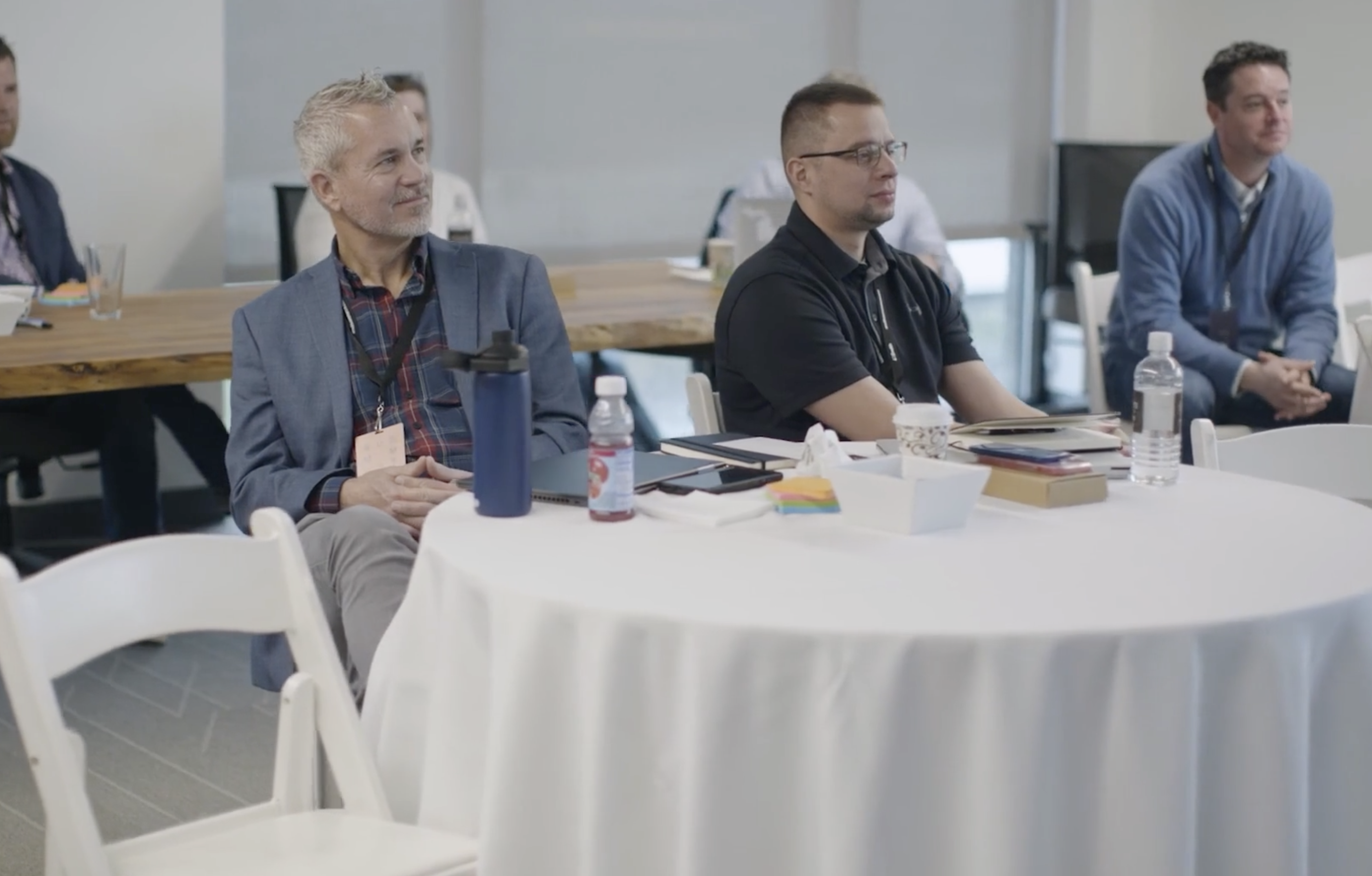 Image of a person listening to a presentation